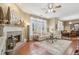 Spacious living room with fireplace, tile flooring, natural light and comfortable seating at 6382 Mountain Ridge Cir, Sugar Hill, GA 30518