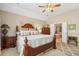 Elegant main bedroom featuring a ceiling fan and luxurious ensuite bathroom at 6382 Mountain Ridge Cir, Sugar Hill, GA 30518