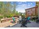 Outdoor patio with outdoor seating, a stone firepit and American Flag at 6382 Mountain Ridge Cir, Sugar Hill, GA 30518