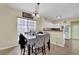 Bright dining area featuring tile flooring and a view of the well-lit kitchen at 984 Redwood Dr, Norcross, GA 30093