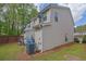 Exterior side view of a townhouse showcasing the lawn and siding at 984 Redwood Dr, Norcross, GA 30093