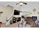 Open-concept living space with fireplace, tiled floors, and staircase to upper level at 984 Redwood Dr, Norcross, GA 30093