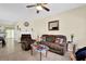 Comfortable living room with plush furniture, ceiling fan, and neutral decor at 984 Redwood Dr, Norcross, GA 30093