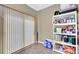 A pantry closet with storage shelves next to the door to the backyard at 984 Redwood Dr, Norcross, GA 30093