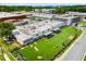 Aerial view of a large building with a turf lawn, picnic tables and a putting green at 1390 Stirling Nw Cir, Atlanta, GA 30318