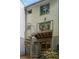 Backyard featuring a spiral staircase, second story porch, and mature landscaping at 1390 Stirling Nw Cir, Atlanta, GA 30318