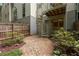 Backyard featuring a spiral staircase, rock garden, and mature landscaping at 1390 Stirling Nw Cir, Atlanta, GA 30318