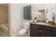 Bathroom featuring granite countertops, a sink, a toilet, and a bathtub shower at 1390 Stirling Nw Cir, Atlanta, GA 30318