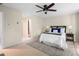 Bedroom featuring a ceiling fan, carpeted floors, and a decorative headboard at 1390 Stirling Nw Cir, Atlanta, GA 30318