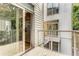 Exterior view of a home with a wood deck that leads into the home at 1390 Stirling Nw Cir, Atlanta, GA 30318