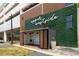 Modern exterior with green wall and 'upper westside' script, plus an outdoor structure at 1390 Stirling Nw Cir, Atlanta, GA 30318