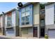Townhome exterior showcasing modern design and individual garages at 1390 Stirling Nw Cir, Atlanta, GA 30318