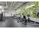 Community gym with a range of cardio and strength training equipment and large windows at 1390 Stirling Nw Cir, Atlanta, GA 30318