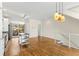 Sunlit kitchen opens to a dining/living area, featuring stainless appliances, light cabinets, and a kitchen island at 1390 Stirling Nw Cir, Atlanta, GA 30318