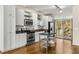 Bright kitchen boasts stainless steel appliances, light cabinets and wood floors, with a kitchen island at 1390 Stirling Nw Cir, Atlanta, GA 30318