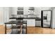 Kitchen boasting stainless appliances, ample cabinet space, and hardwood floors at 1390 Stirling Nw Cir, Atlanta, GA 30318