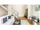 Bright living room featuring modern decor, hardwood floors, and a staircase at 1390 Stirling Nw Cir, Atlanta, GA 30318