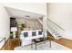 Living room with an open floor plan, modern staircase, and hardwood floors at 1390 Stirling Nw Cir, Atlanta, GA 30318