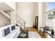 Bright living room featuring modern decor, hardwood floors, and a staircase at 1390 Stirling Nw Cir, Atlanta, GA 30318