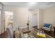 Spacious office featuring a glass table, desk chair, and hardwood floors at 1390 Stirling Nw Cir, Atlanta, GA 30318
