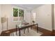 Bright office space with modern table, decor, and large window showcasing the natural outdoor view at 1390 Stirling Nw Cir, Atlanta, GA 30318