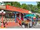 Colorful Nuevo Laredo Restaurant exterior with festive decorations and outdoor seating area at 1390 Stirling Nw Cir, Atlanta, GA 30318
