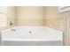 Clean bathroom with a well maintained soaking tub at 143 Massey Ln, Locust Grove, GA 30248