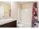 Clean bathroom featuring a bathtub, shower, toilet, vanity, and fun shower curtain at 143 Massey Ln, Locust Grove, GA 30248