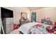 Cozy bedroom featuring a dresser, window with curtains, and carpeted floors at 143 Massey Ln, Locust Grove, GA 30248