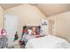 Charming bedroom with a fun theme, featuring a cozy bed and neutral paint at 143 Massey Ln, Locust Grove, GA 30248