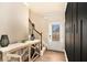 Welcoming foyer with modern decor, elegant staircase, and stylish wood flooring at 143 Massey Ln, Locust Grove, GA 30248