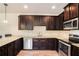 Well-equipped kitchen showcasing granite countertops, ample cabinet space, and modern appliances at 143 Massey Ln, Locust Grove, GA 30248