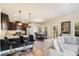 Open concept kitchen and dining area with modern countertops and stainless steel appliances at 143 Massey Ln, Locust Grove, GA 30248
