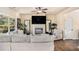 Comfortable living room featuring a fireplace, large windows, and modern decor at 143 Massey Ln, Locust Grove, GA 30248