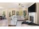 Stylish living room with fireplace, large windows, and an open concept design at 143 Massey Ln, Locust Grove, GA 30248