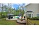 A private back yard oasis with a pool, patio, grill, and gazebo offers the perfect outdoor retreat at 156 Brookridge Ct, Douglasville, GA 30134