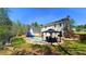 Backyard featuring a pool, dining area, and a slide at 156 Brookridge Ct, Douglasville, GA 30134