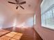 Bedroom featuring laminated wood floor, white walls, ceiling fan and natural light at 156 Brookridge Ct, Douglasville, GA 30134