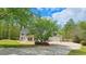 Attractive two-story house with a well-kept lawn, patio, basketball hoop and garage at 156 Brookridge Ct, Douglasville, GA 30134
