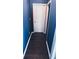 Hallway with navy blue walls and dark wood flooring at 156 Brookridge Ct, Douglasville, GA 30134