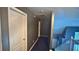 Hallway featuring a door and staircase at 156 Brookridge Ct, Douglasville, GA 30134