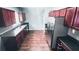 Spacious kitchen with dark wood cabinets, stainless steel appliances, and a long countertop at 156 Brookridge Ct, Douglasville, GA 30134