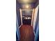 Cozy laundry room with black appliances and dark wood flooring at 156 Brookridge Ct, Douglasville, GA 30134