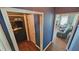 Hallway view to laundry room and sitting room with a fireplace at 156 Brookridge Ct, Douglasville, GA 30134