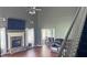 Living room with hardwood flooring, fireplace, and view into the adjacent dining room at 156 Brookridge Ct, Douglasville, GA 30134