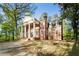 Charming brick colonial with prominent columns, multi-pane windows, and a well-maintained front lawn at 1961 River Forest Rd, Atlanta, GA 30327
