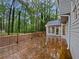 Spacious back deck area perfect for entertaining and outdoor living with lush trees at 9174 Retreat Pass, Jonesboro, GA 30236