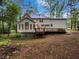 A cozy deck overlooking a mature tree canopy at 9174 Retreat Pass, Jonesboro, GA 30236