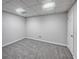 Newly carpeted basement space with modern recessed lighting at 9174 Retreat Pass, Jonesboro, GA 30236