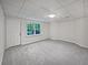 Unfinished basement with an egress window and door, ready to be transformed at 9174 Retreat Pass, Jonesboro, GA 30236